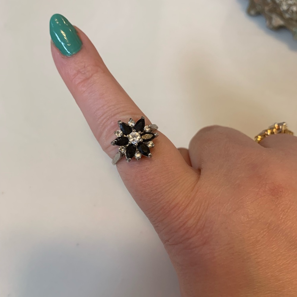 Elevated blue and clear crystal stone flower silver ring. No marks size 9